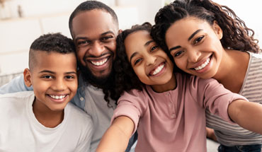 Oak Hill Dental Group | Contact | Smiling Guy on Phone